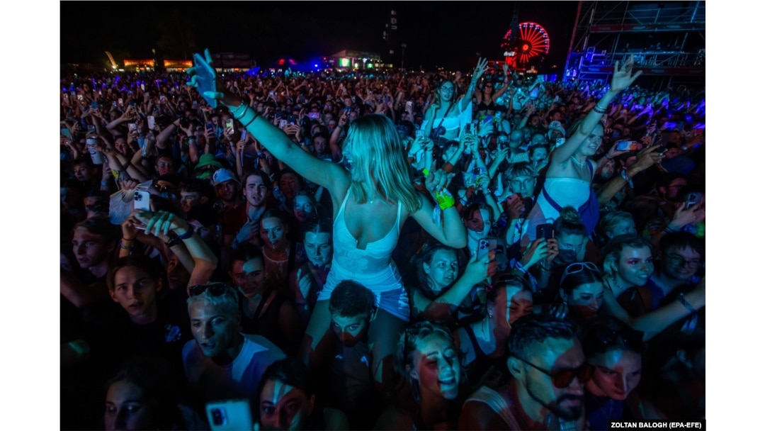 Fans watch U.S. rapper Macklemore at the 2023 Sziget Festival.