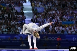 Kharlan celebrates after winning against South Korea's Choi Se-Bin in the women's saber individual bronze-medal bout during the 2024 Paris Olympics.