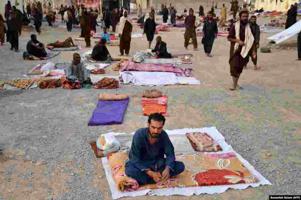 Drug addicts sit inside an Afghan drug rehabilitation and treatment center in the Takhta Pul district of Kandahar Province