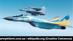 A Ukrainian MiG-29 flies next to American F-16 fighter jets. (file photo)