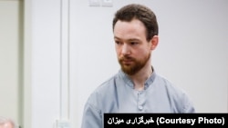 Johan Floderus appears in court in Tehran on December 20.