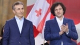 Georgian Dream founder Bidzina Ivanishvili (left) and Prime Minister Irakli Kobakhidze attend a party rally in Tbilisi in April. 