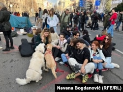 Students and young activists protesting alleged voter fraud block a road in central Belgrade on December 29.