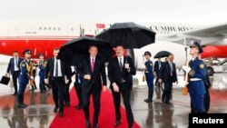 Azerbaijan - Azerbaijani President Ilham Aliyev welcomes Turkish President Tayyip Erdogan upon his arrival at Nakhichevan airport, September 25, 2023.
