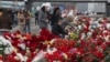 People mourn and bring flowers to the Crocus City Hall concert venue following a terrorist attack in Krasnogorsk, outside Moscow, on March 25.