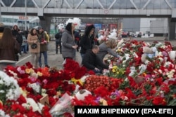 Mourners place flowers by the Crocus City Hall concert venue following a terrorist attack in Krasnogorsk, outside Moscow, Russia, on March 25.