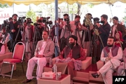 Afghan journalists attend an event to mark World Press Freedom Day at the office of the Afghan Independent Journalists Association in Kabul on May 3.
