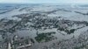 Затоплений мікрорайон Херсона внаслідок руйнування контрольованої і замінованої Росією греблі Каховського водосховища. Україна, 10 червня 2023 року