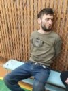 Dalerjon Mirzoev este fotografiat imediat după reținerea sa în regiunea Briansk, pe 23 martie. El este unul dintre cei patru cetățeni tadjici suspectați că au fost implicați în atacul terorist asupra unei săli de concerte de lângă Moscova, din 22 martie, care a provocat cel puțin 137 de morți și peste 180 de răniți.