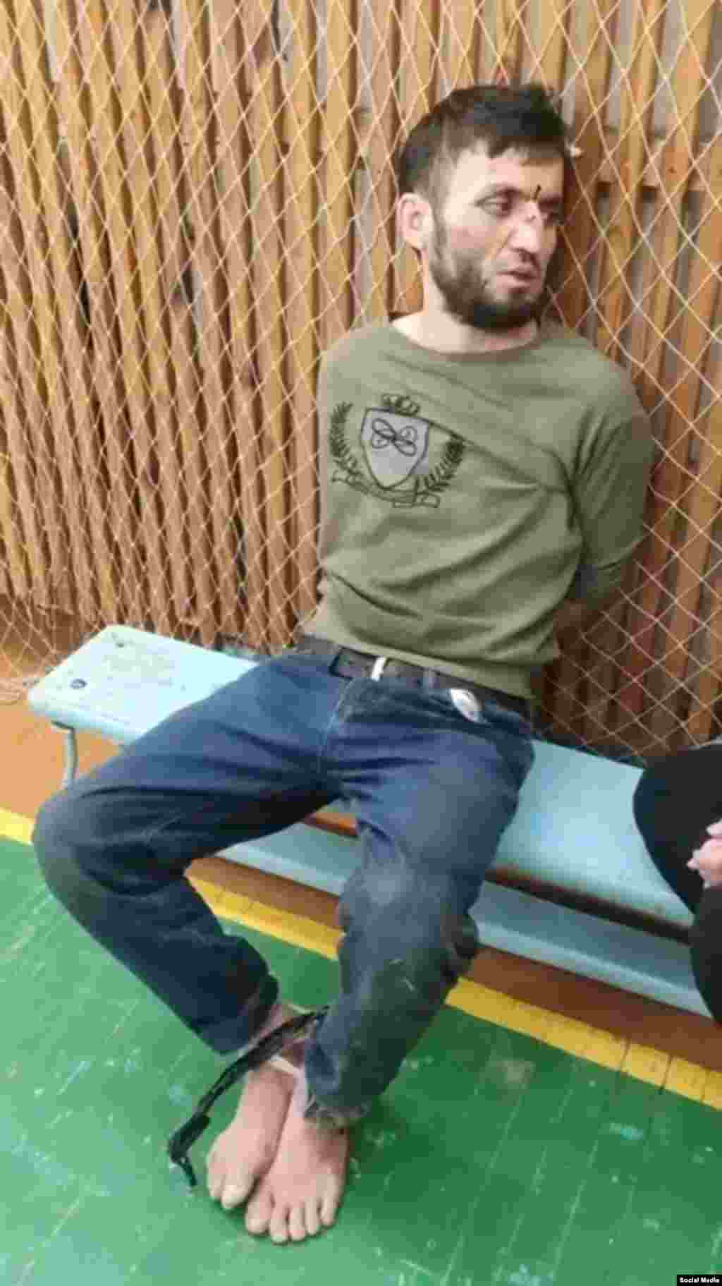 Dalerjon Mirzoev is seen immediately after his capture in the Bryansk region on March 23. He was captured on suspicion of being one of four Tajik nationals involved in the terrorist attack on a concert hall near Moscow on March 22 that left at least 137 dead and more than 180 injured.