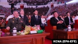 Russian Defense Minister Sergei Shoigu (front left) and North Korean leader Kim Jong Un (front right) attend an event in Pyongyang on July 27. 