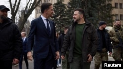 Ukraine's President Volodymyr Zelenskiy (right) and Dutch Prime Minister Mark Rutte walk in downtown Kharkiv on March 1.