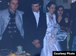 Tengiz Tsulukiya (in black jacket) photographed alongside his wife, Sharizan