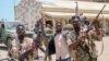 Войници от суданската армия, верни на лидера си Абдел Фатах ал Бурхан, позират за снимка в базата на Силите за бърза подкрепа (СБП) в град Порт Судан, 16 април 2023 г.