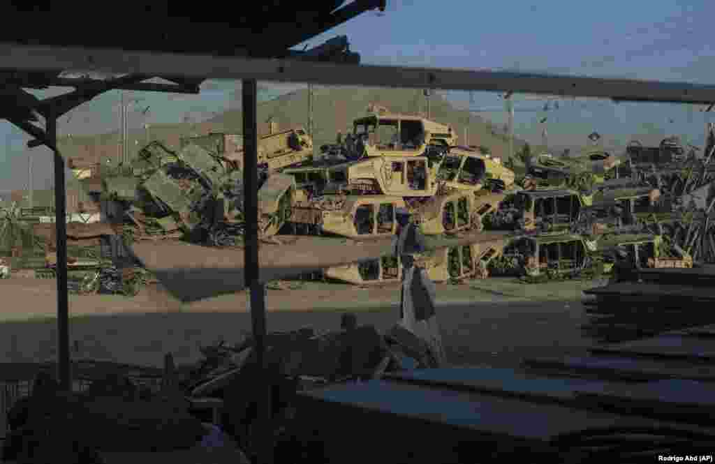 Destroyed Humvees used by the U.S. Army during the war against the Taliban in Afghanistan are seen stacked to be sold as scrap metal in Kandahar city.