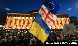 Thousands of demonstrators marched through the Tbilisi on March 8 to protest against government plans to introduce a "foreign agent" law reminiscent of Russian legislation used to silence critics.