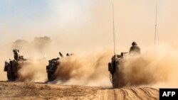 Израильские танки, дислоцированные на границе сектора Газа в ожидании начала сухопутной операции. 13 октября 2023 года