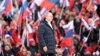 Президент России Владимир Путин выступает с речью во время концерта, посвященного восьмой годовщине аннексии Крыма Россией, на стадионе «Лужники» в Москве, Россия, 18 марта 2022 года.