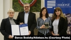 Tamas Bodoky (second from left) and Atlatszo.hu staffers receive the National Association of Hungarian Journalists' annual Press Award in March 2024.