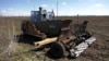 GRAB A Remote-Controlled Armored Tractor Hits The Mine-Strewn Fields Of Ukraine