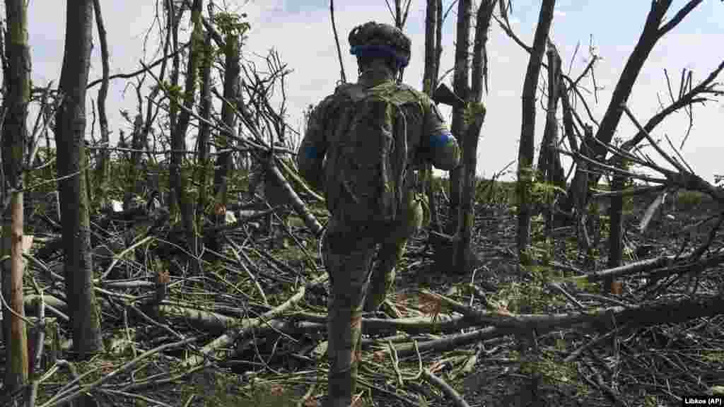 Amid the devastated landscape, a Ukrainian soldier makes his way toward a position. &quot;The enemy does not abandon his plans to reach the borders of the Donetsk and Luhansk regions,&quot;&nbsp;General Syrskiy wrote on Telegram.