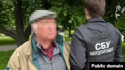 Detained associates of Viktor Medvedchuk are seen in a photo released by the Security Service of Ukraine on May 15.