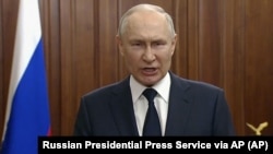 Президент России Владимир Путин во время видеообращения в связи мятежом ЧВК «Вагнер» (скриншот с видео). Москва, 26 июня 2023 года