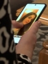 Bosnia and Hercegovina, femicide victim's mother mother showing a picture of Alma 