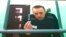 Russian opposition leader Aleksei Navalny appears via video link during a hearing at the Russian Supreme Court in Moscow on June 22.d