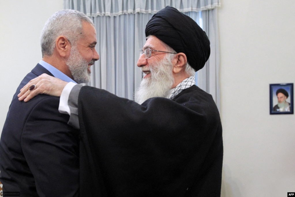 Ayatollah Ali Khamenei greets Hamas leader Ismail Haniyeh (left) during a meeting in Tehran in 2012.