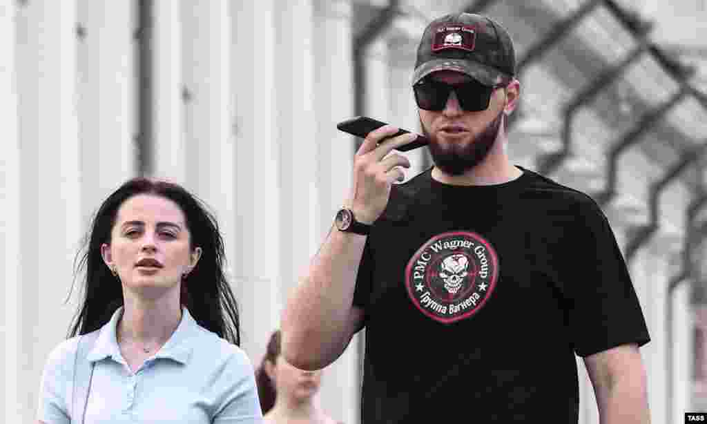 A man wearing a t-shirt and cap emblazoned with the emblem of Russia&#39;s Wagner Group in Moscow on June 25.&nbsp; After a deal brokered by Belarusian strongman Alyaksandr Lukashenka, Prigozhin called off his June 24 rebellion as a large column of Wagner fighters and hardware were nearing Moscow.&nbsp; &nbsp;