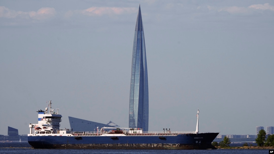 An oil tanker in the Gulf of Finland passes the Lakhta Center skyscraper, the headquarters of Russian gas monopoly Gazprom, in St. Petersburg, Russia, in June 2023.