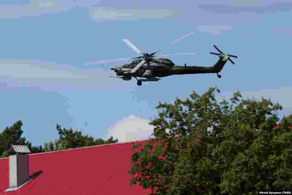 A Russian military helicopter is seen above Shebekino on June 6. Both the Russian military and anti-Kremlin Russian militants have made conflicting claims about who controls various Russian towns near the border with Ukraine. &nbsp;