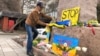 Kazakh civic activist Marat Turymbetov lays flowers on a monument to Ukrainian poet Taras Shevchenko in the Kazakh city of Almaty on February 24.