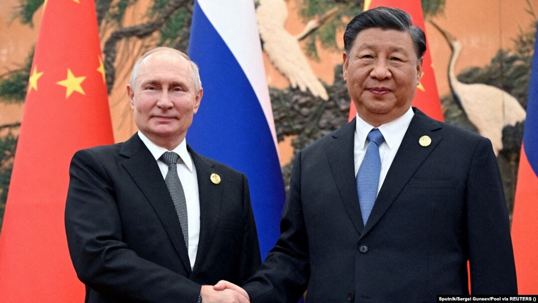 Russian President Vladimir Putin (left) and Chinese President Xi Jinping. (file photo)