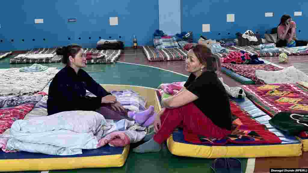 Women who were displaced by the flooding in Aqtobe rest at a gym that is now being used as an evacuation center.