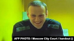 Aleksei Navalny appears on screen via video link during a preliminary hearing in a new case against him on accusations of various extremism-related charges at the Moscow City Court in Moscow on May 31.