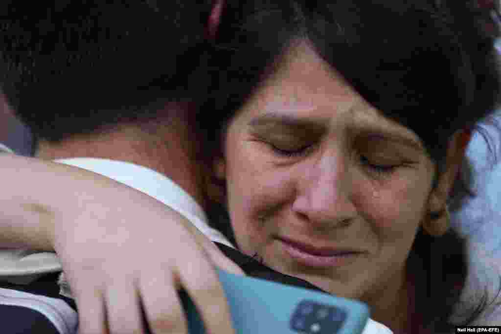 A woman weeps during a pro-Israeli rally in London on October 9.&nbsp;