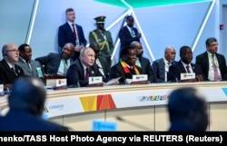 Russian President Vladimir Putin (center left) attends a session of the Russia-Africa Summit in St. Petersburg on July 28.