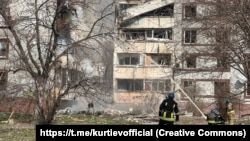 Rescuers work at the scene after an apartment building was damaged by a Russian missile strike in Zaporizhzhya on March 22.