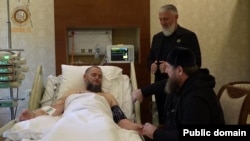 A video posted on September 20 shows Chechen leader Ramzan Kadyrov (front right) visiting his uncle at a Moscow hospital. 