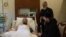 A video posted on September 20 shows Chechen leader Ramzan Kadyrov (front right) visiting his uncle at a Moscow hospital. 