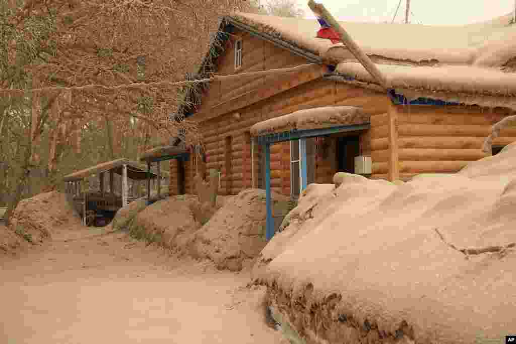 Homes in the village of Klyuchi were also covered in ash.