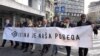 Colleagues of Slavko Curuvija on the street in Belgrade with a banner on the anniversary of his murder