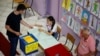 A man casts his ballot in snap parliamentary elections in the Montenegrin capital, Podgorica, on June 11. 