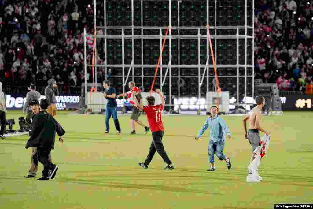 After the win, fans stormed the pitch at the stadium in Tbilisi.