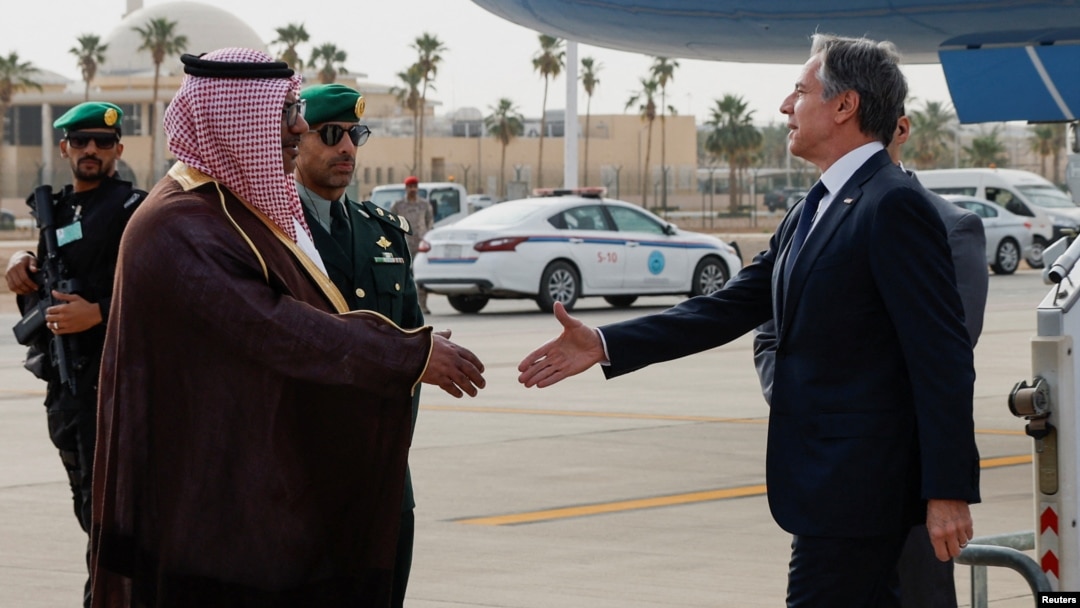 U.S. Secretary of State Antony Blinken (left) is welcomed by Saudi officials on a visit to Riyadh during a Gaza diplomacy push late last month. 