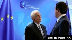 European Union foreign policy chief Josep Borrell (left) speaks with Kosovar Prime Minister Albin Kurti prior to talks in Brussels on June 26.