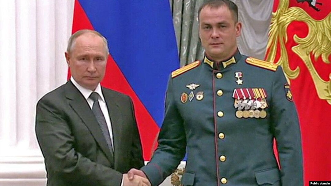 Russian President Vladimir Putin (left) after awarding Irek Magasumov the Hero of Russia medal.