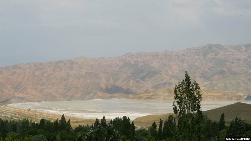 A pool of runoff from the gold-refining process at the Zarafshon mine, which contains cyanide, can be seen from a nearby ridge in May 2023. Villagers have complained to the government that the emissions are harmful to them and the environment.